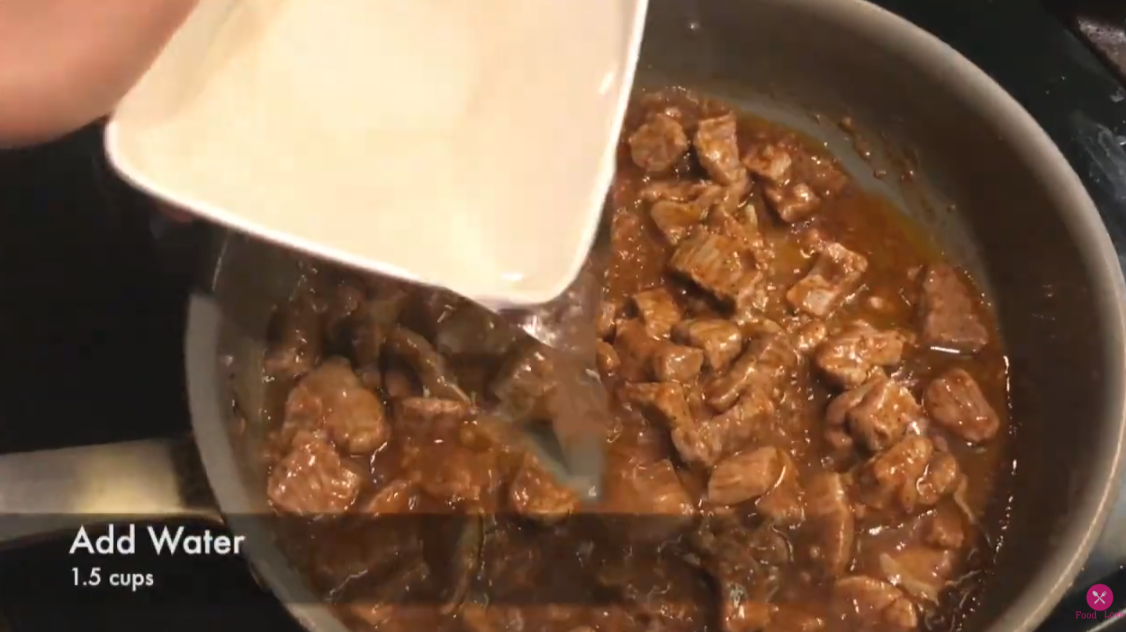 adding water in the cooking beef