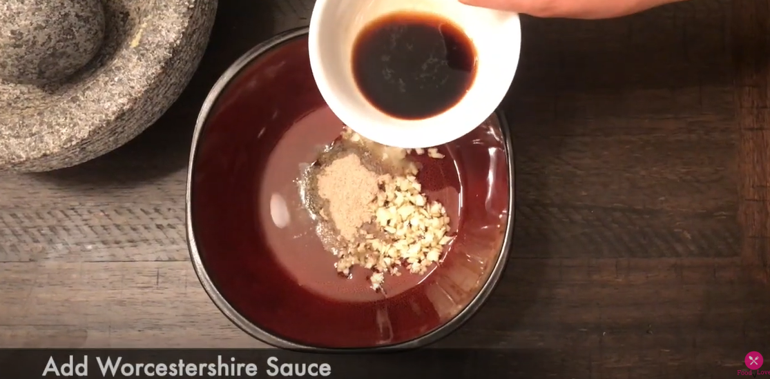 adding worcestershire sauce to the bowl