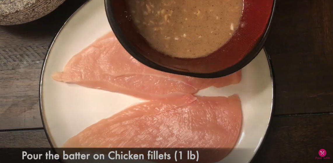 applying the mixture to the chicken breast pieces