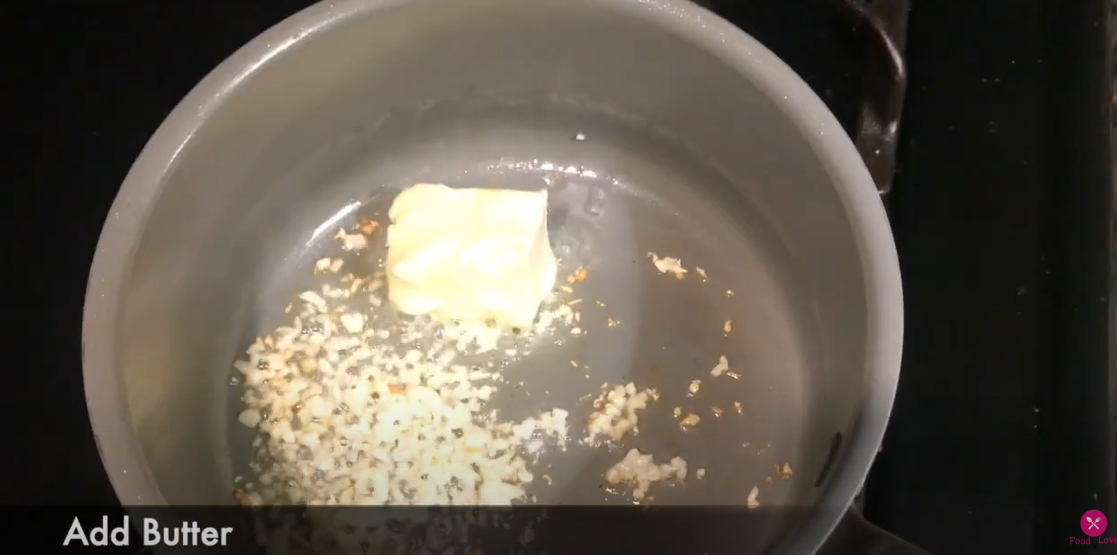 a pan with oil, garlic and butter