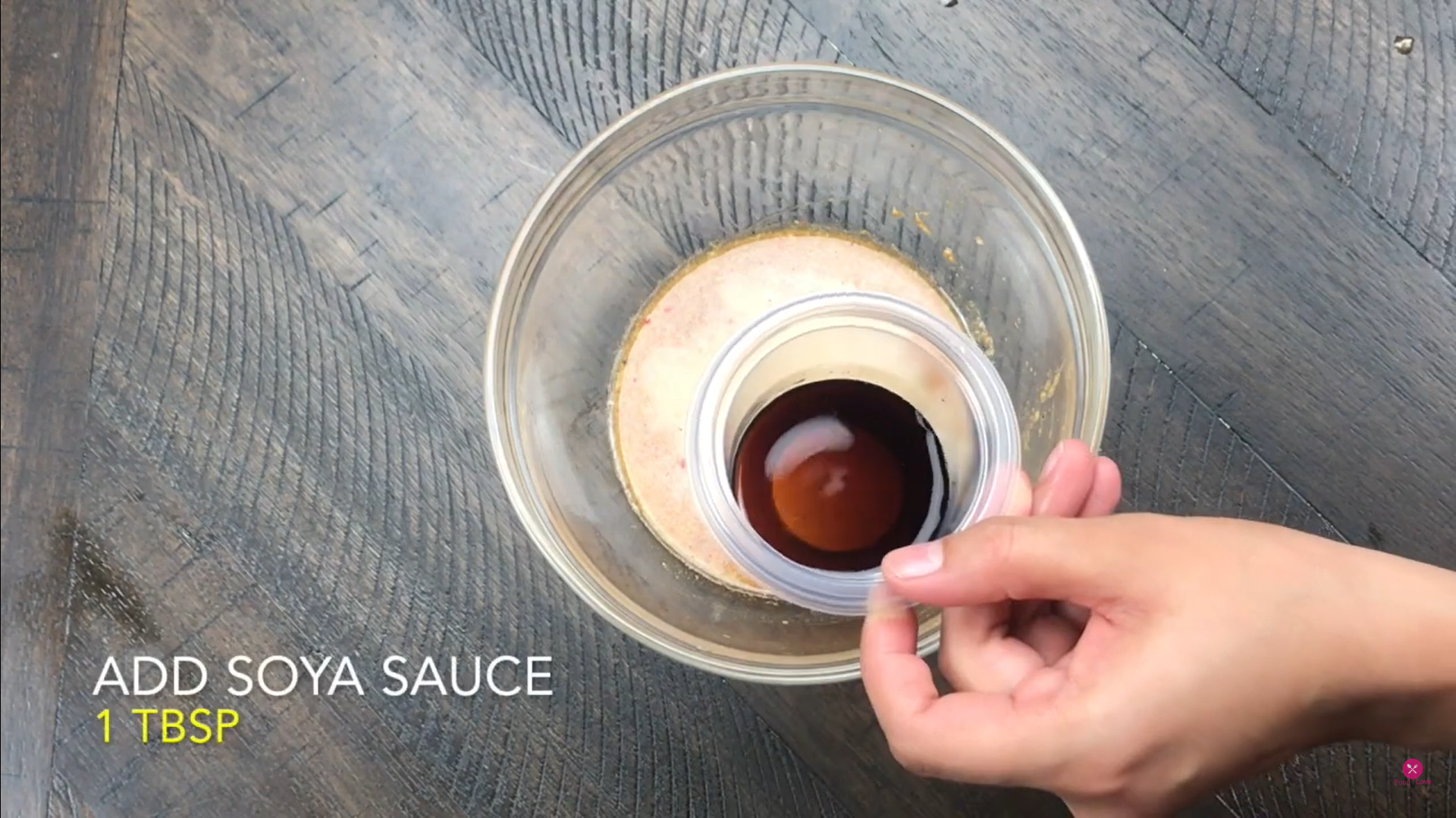 adding soy sauce in a mixture