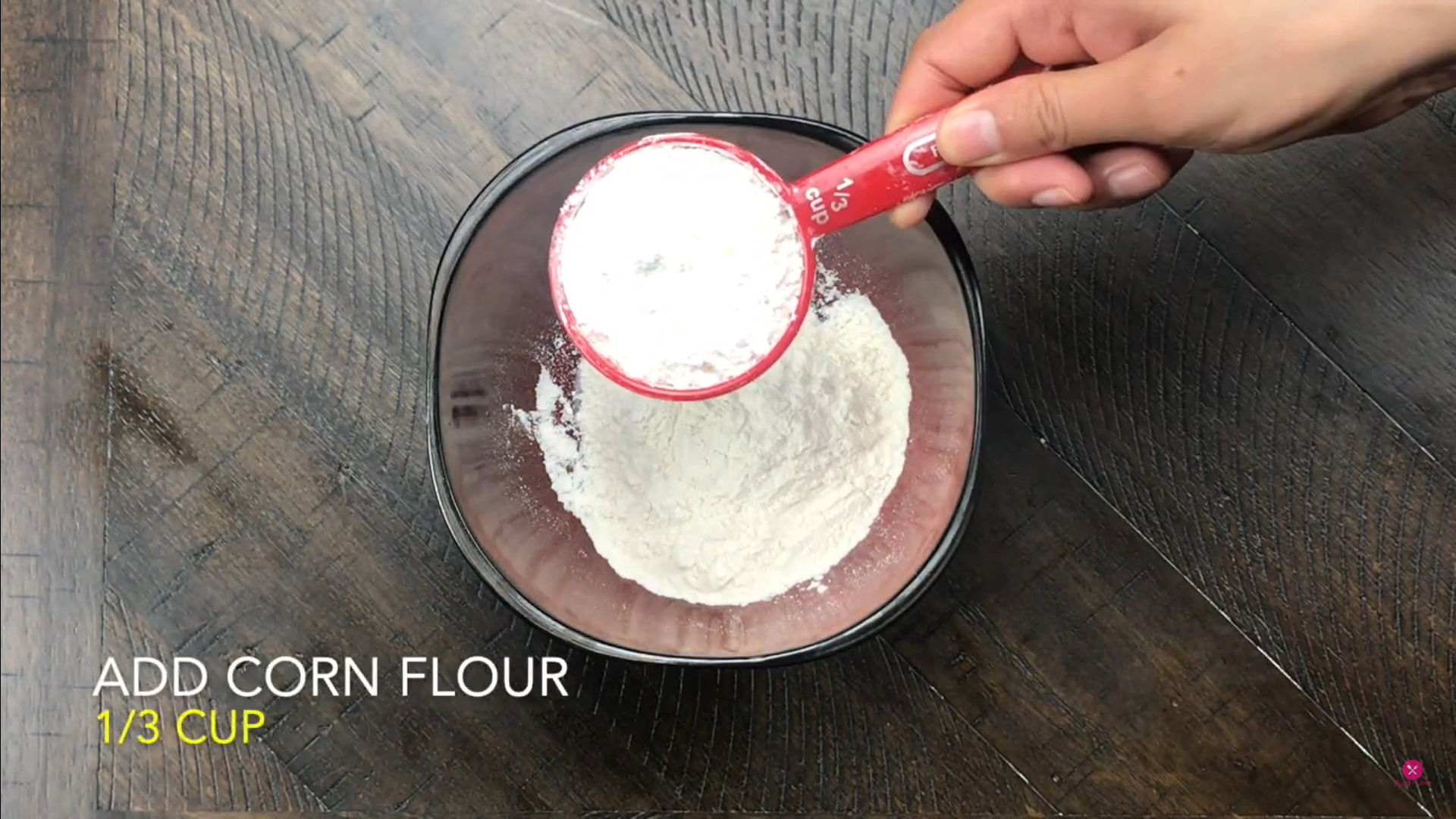 adding dry ingredients in a bowl