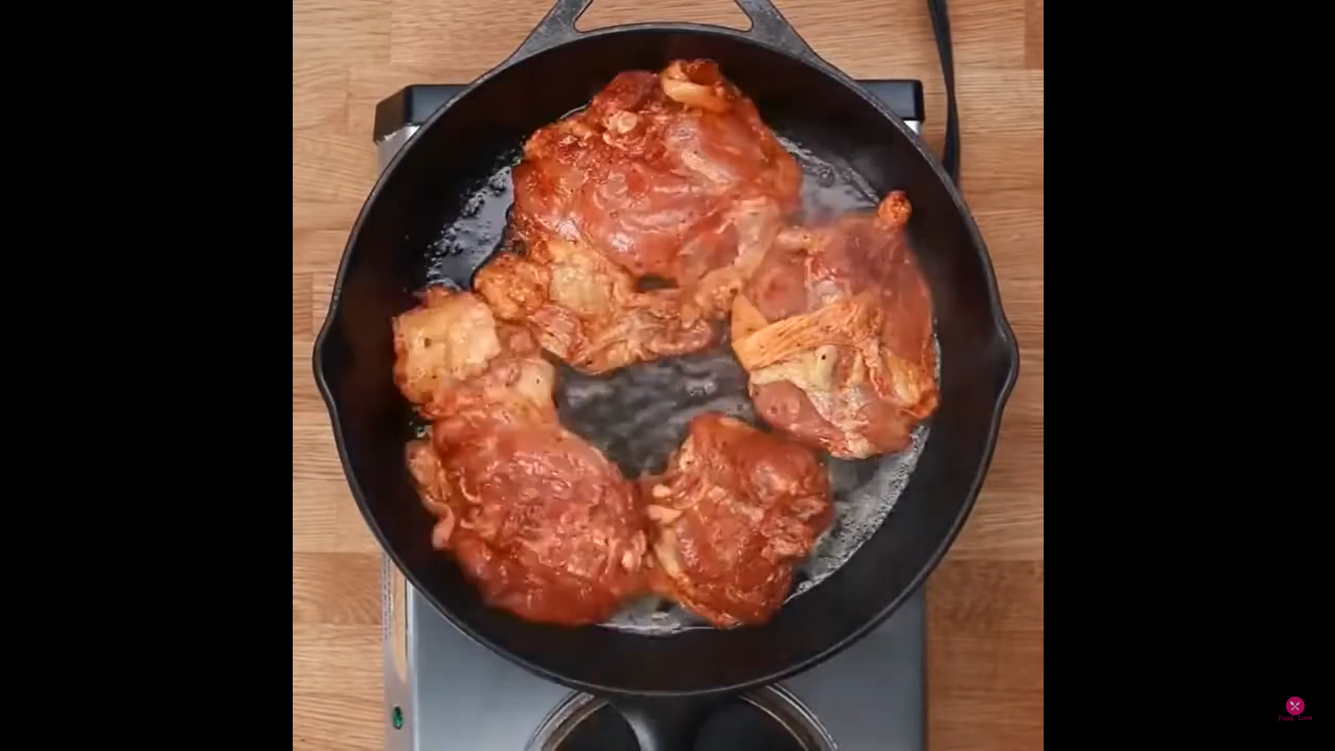 chicken being cooked in a pan