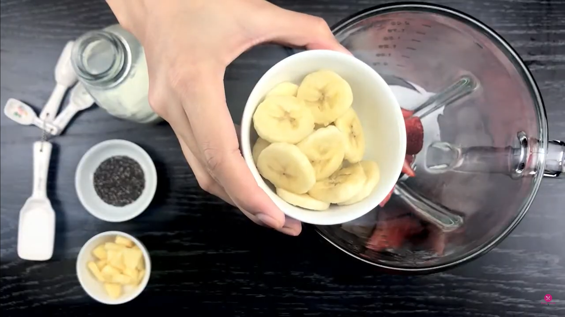 adding sliced banana in the blender