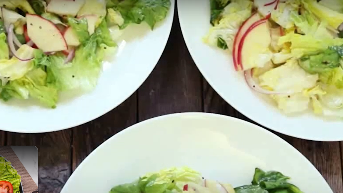 distributing salad in serving plates