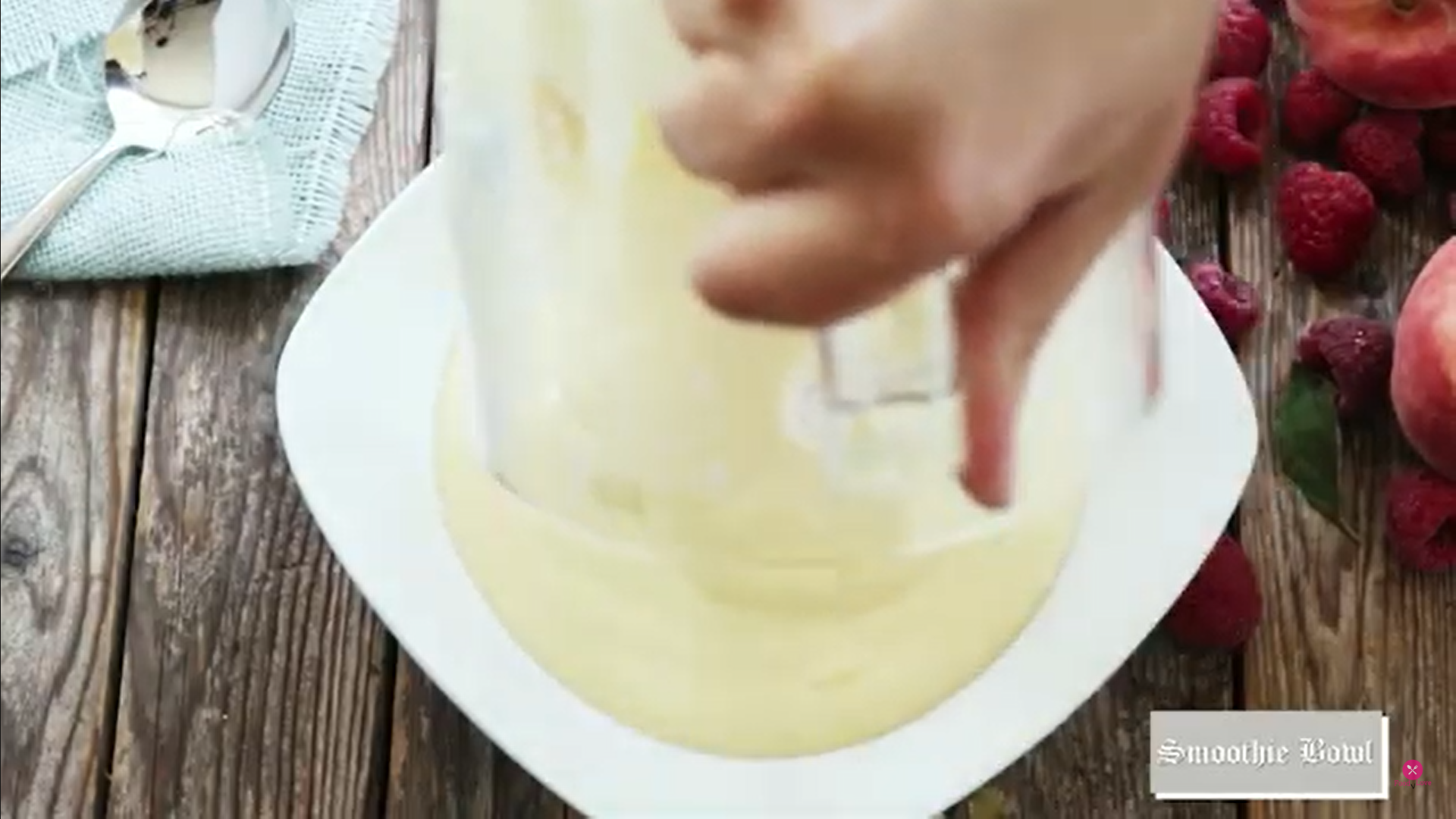 pouring out the smoothie in a bowl