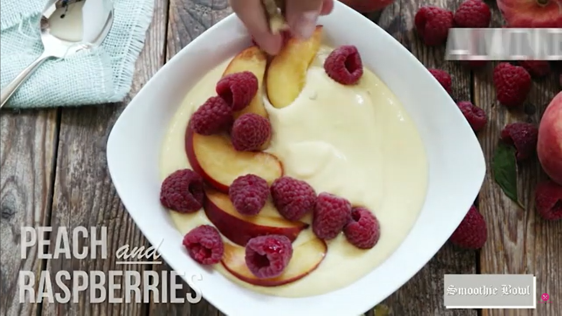 garnishing smoothie with fresh fruits