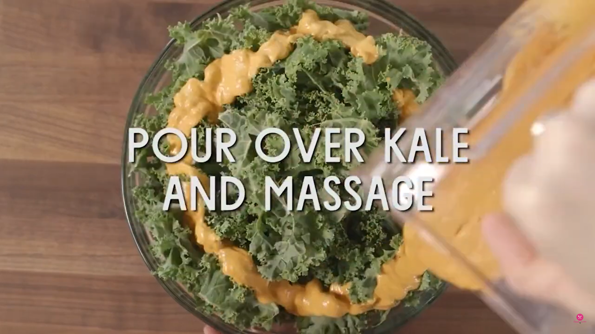 pouring blended mixture over kale