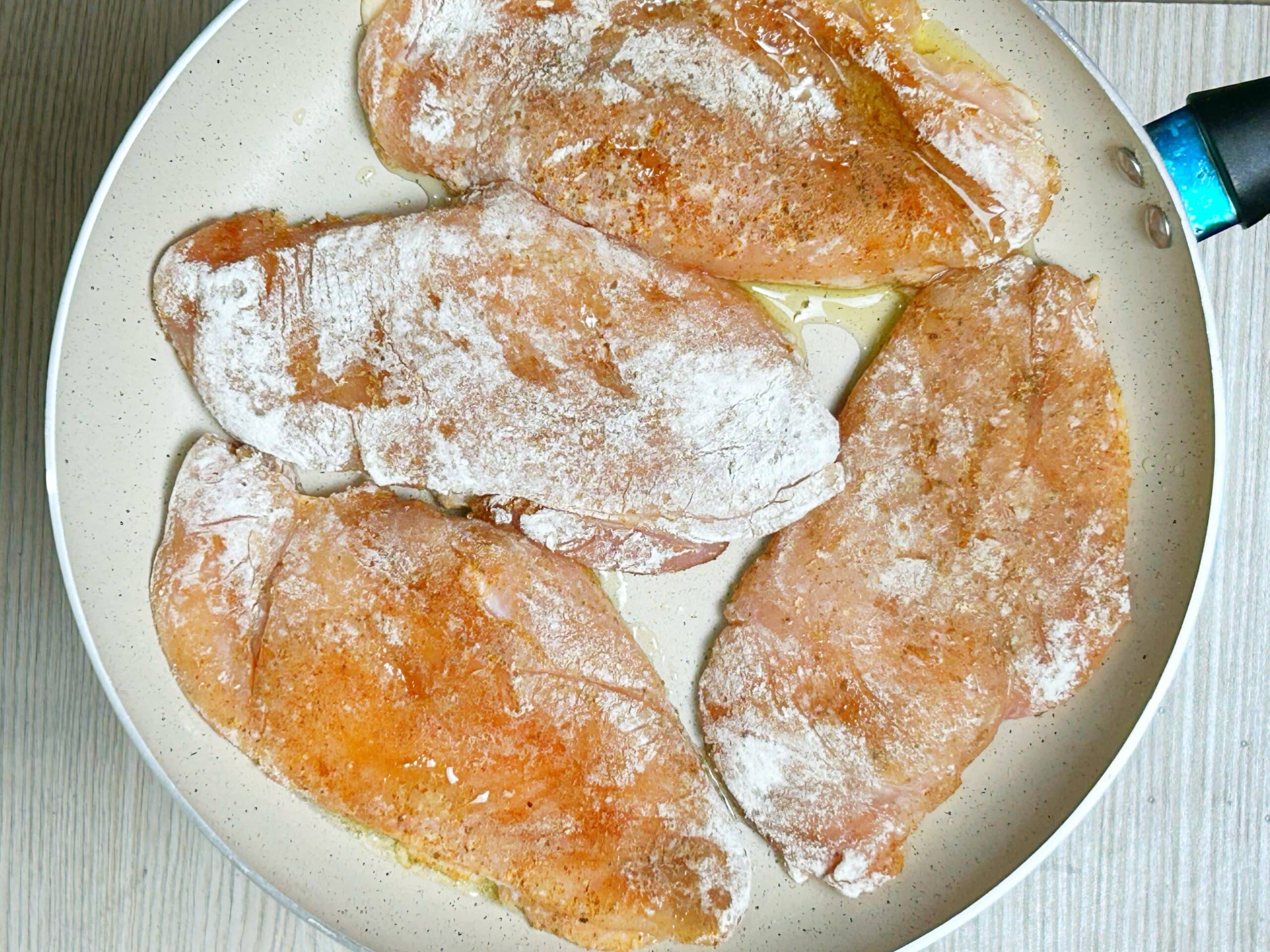 chicken breast pieces covered in flour