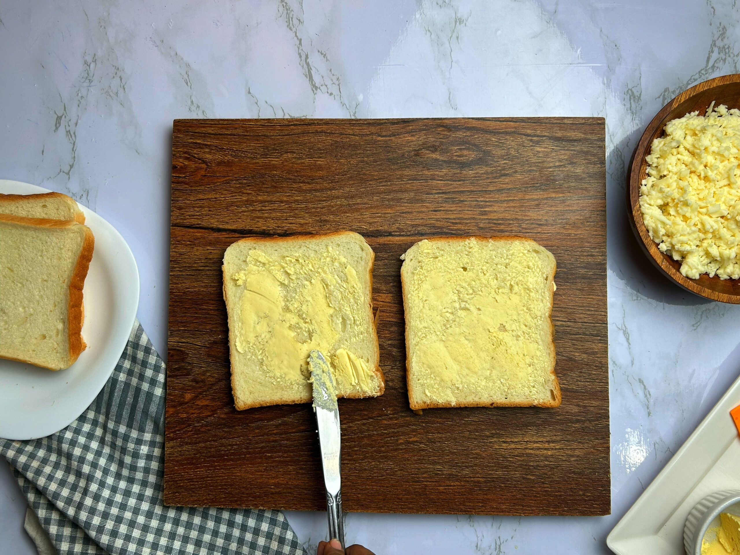 applying butter on the bread