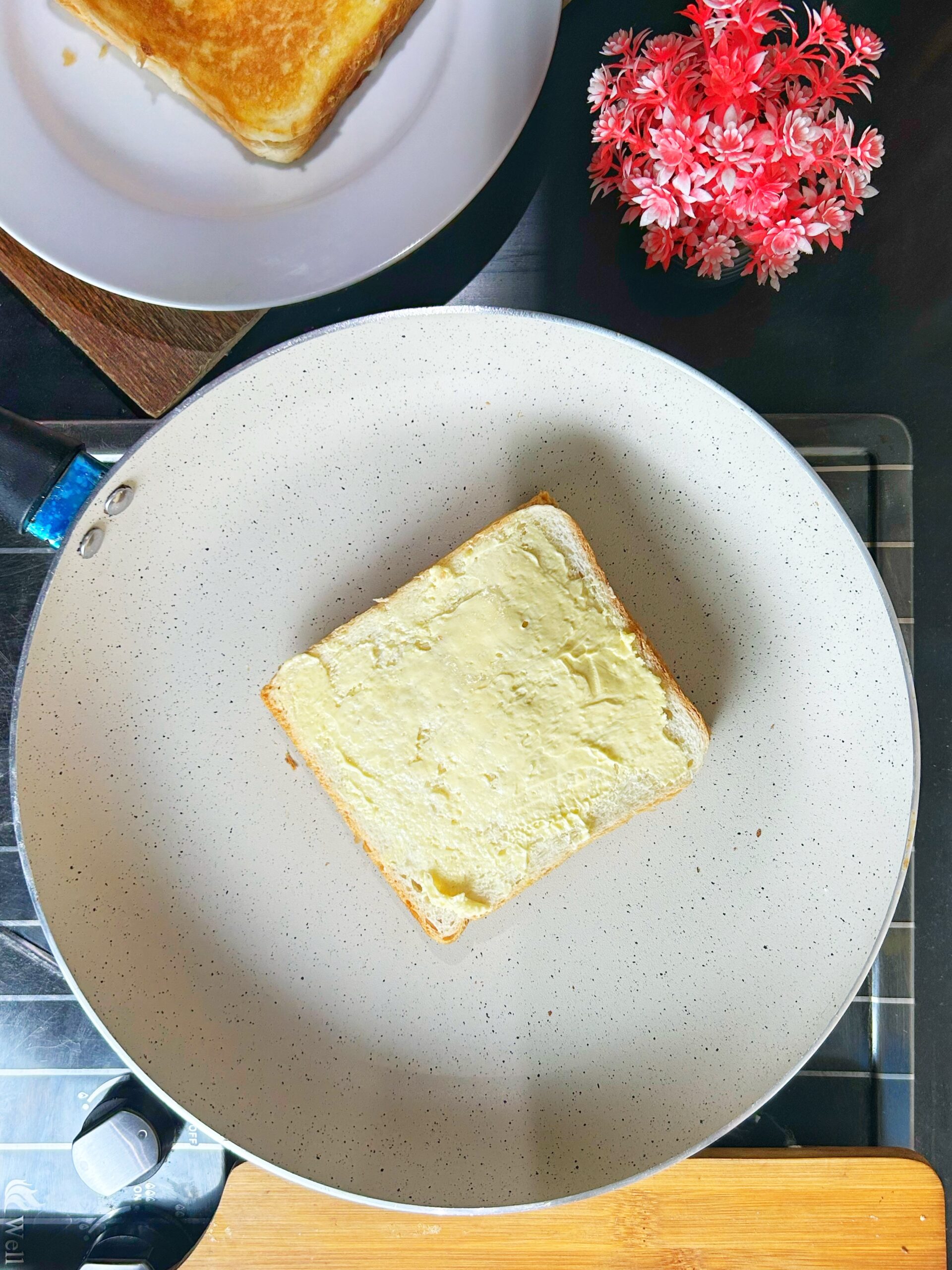 cooking the cheese sandwich on the pan