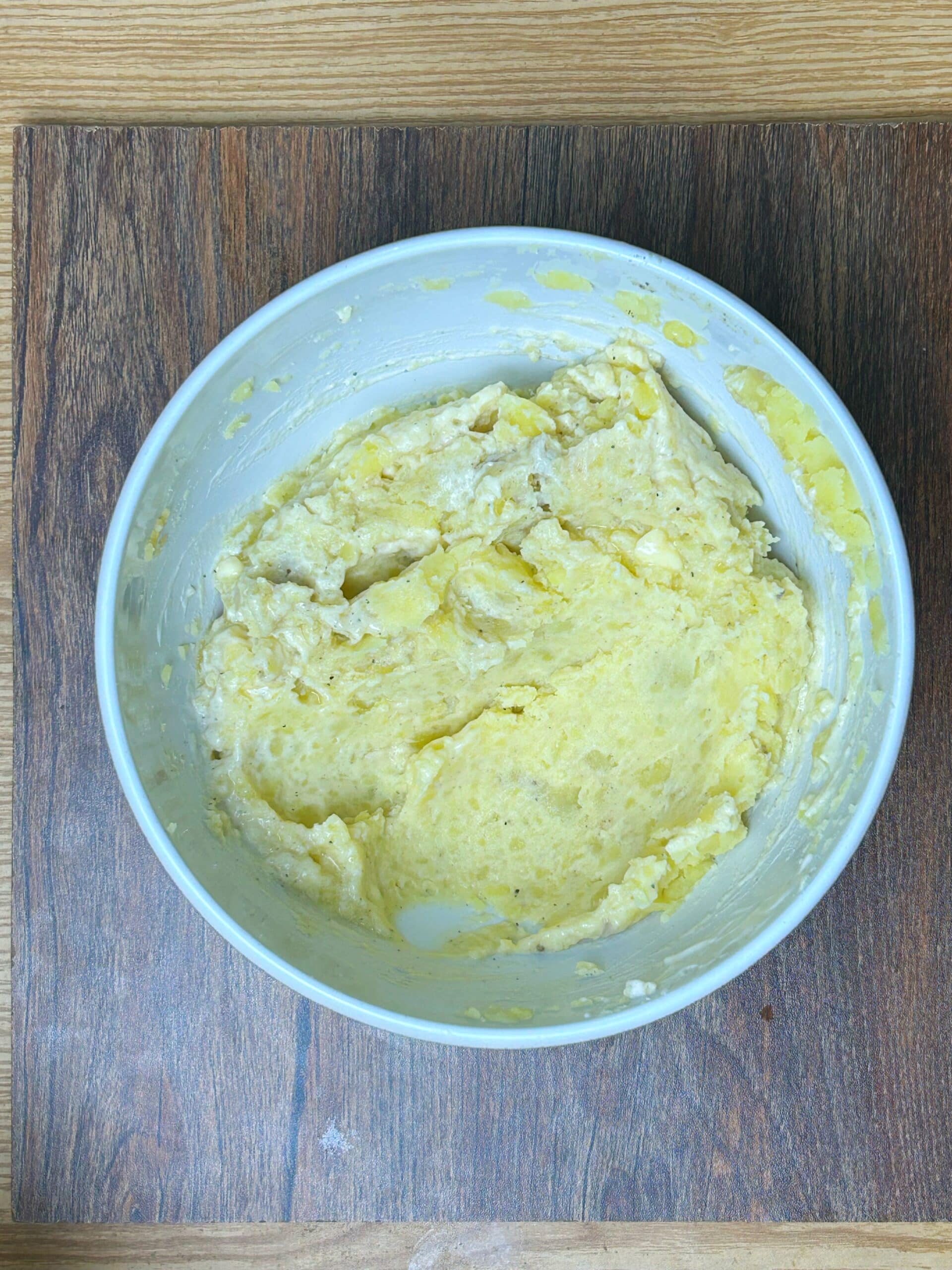 making mashed potatotes in a bowl